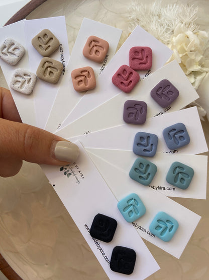 Small square stud earrings with leaf pattern embossed. 9 different colours.